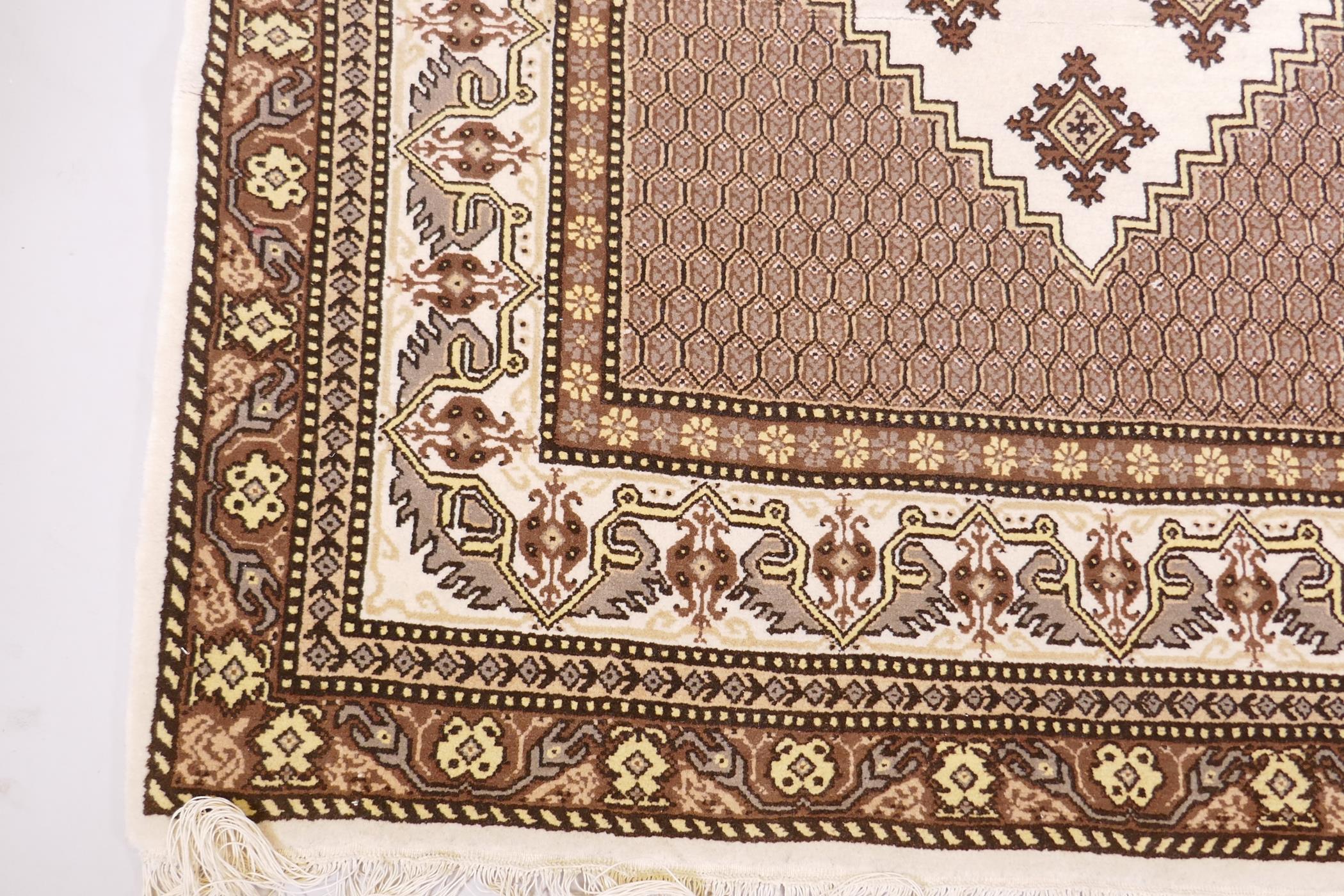 A Tunisian cream ground geometric rug with brown borders, 118cm x 190cm - Image 3 of 6