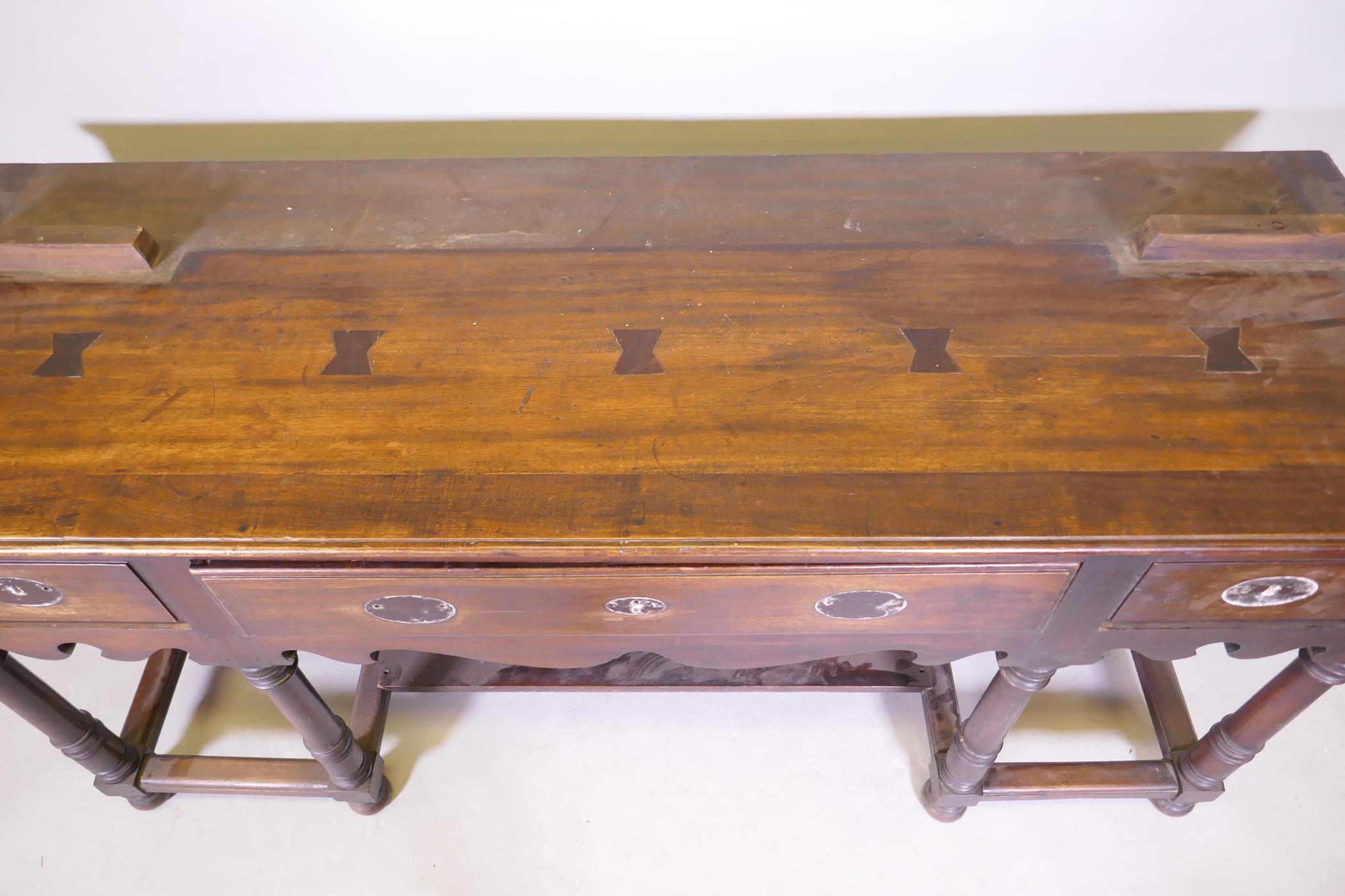 A South African hardwood Georgian style dresser base, with three drawers and shaped apron, raised on - Image 3 of 5