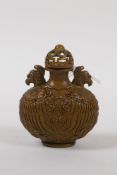 A Chinese bronze snuff bottle with phoenix decoration, impressed 6 character mark to base, 7cm high