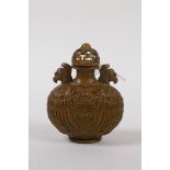 A Chinese bronze snuff bottle with phoenix decoration, impressed 6 character mark to base, 7cm high