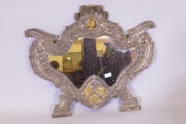 A C19th continental wall mirror, the repousse white metal covers with decorative ormolu mounts, 75cm