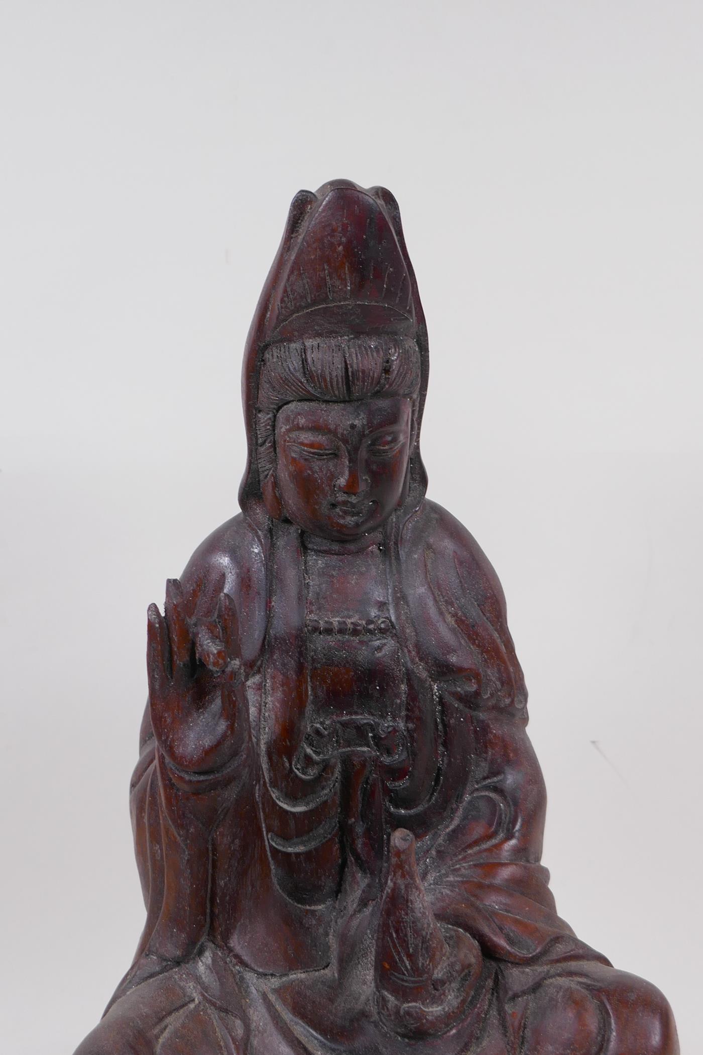 A hardwood carving of Quan Yin, seated upon a lotus throne, 40cm high - Image 2 of 4