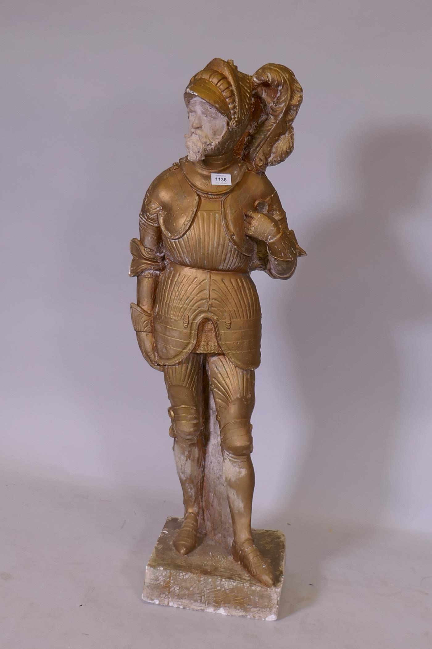 A painted plaster cast figure of a knight in armour, 106cm high