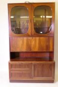 A mid century rosewood side cabinet with illuminated glazed upper section with fall front, and a