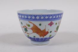 A polychrome porcelain tea bowl decorated with iron red and gilt goldfish, Chinese Daoguang seal