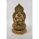 A Chinese brass figure of Buddha seated on a lotus flower, impressed 4 character mark to base,