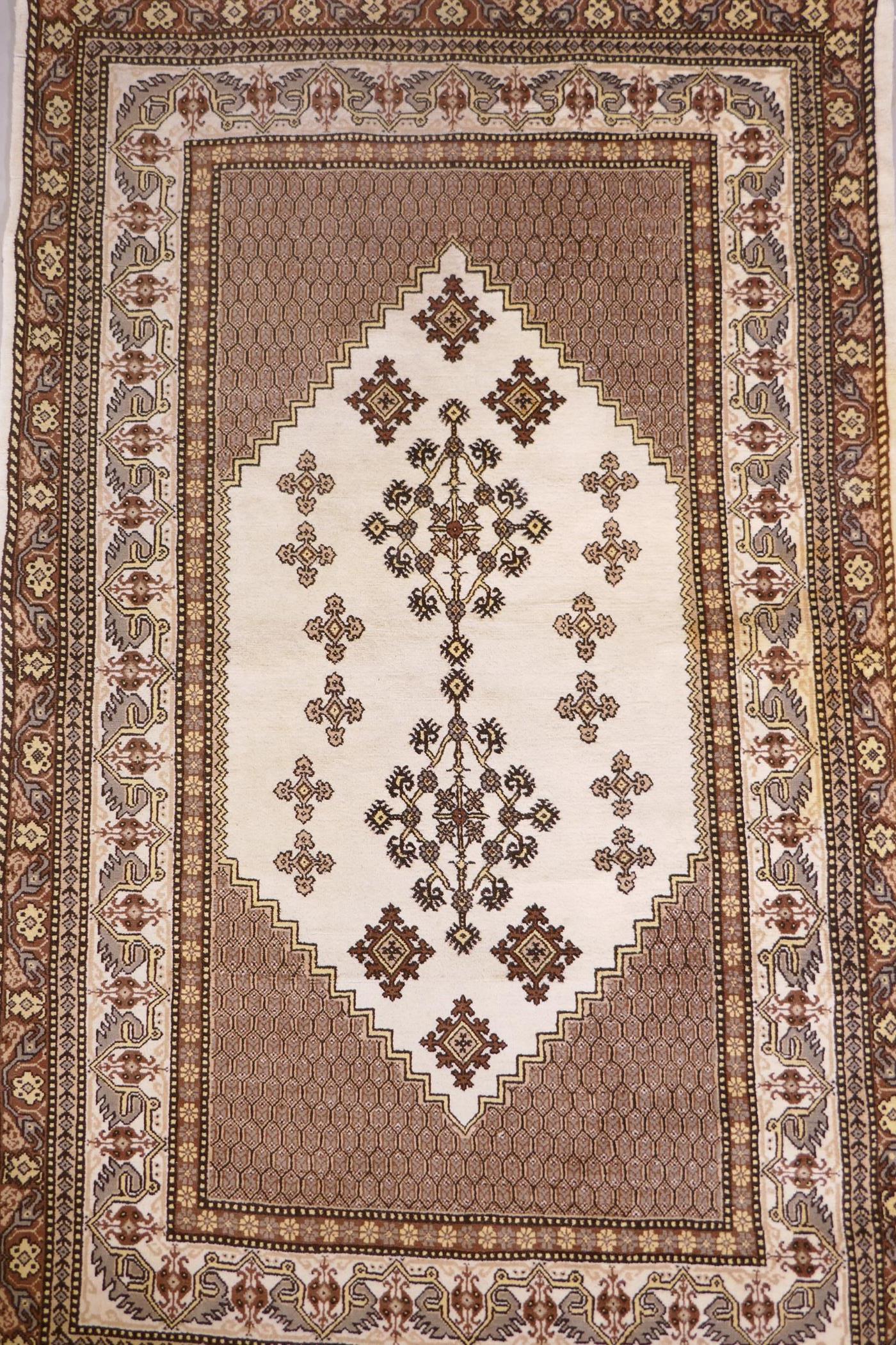 A Tunisian cream ground geometric rug with brown borders, 118cm x 190cm - Image 2 of 6