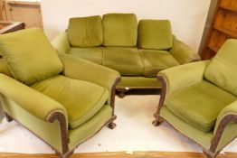 A 1930s mahogany Chippendale style three piece suite, with carved decoration and gadrooned bases