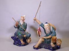 A pair of large Chinese 'mudmen' glazedÿ terracotta figures of fishermen, 80cm high