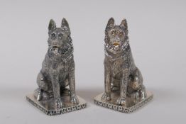 A pair of silver plated condiments in the form of German Shepherd dogs, 8cm high