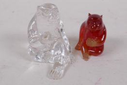 A crystal glass figure of a seated monkey, 5cm high, and a similar figure in amber glass