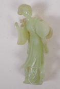A Chinese green hardstone figure of a girl with a lion, 15cm high