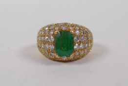 An 18ct yellow gold dress ring, set with diamonds and an emerald, approx 3cts, size K/L