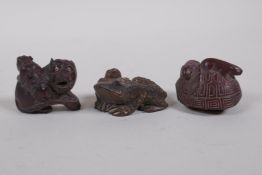Three Japanese carved box wood netsuke in the form of two rats on a tortoise shell, two tigers and