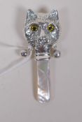 A sterling silver Louis Wain style cats head baby's rattle, 8cm