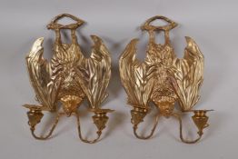 A pair of gothic style ormolu two branch wall sconces in the form of bats, 25cm x 35cm