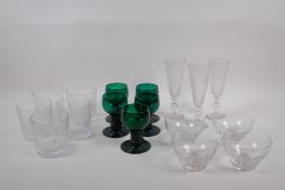 A quantity of C19th drinking glasses including three cut glass champagne flutes, five emerald