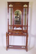 A Victorian walnut hall stand with single drawer, raised on turned supports, lacks stick trays, 92cm