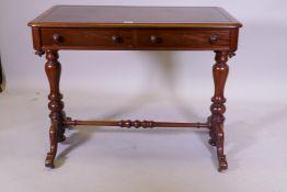 A C19th mahogany writing table with two true and two false drawers, and inset top, raised on