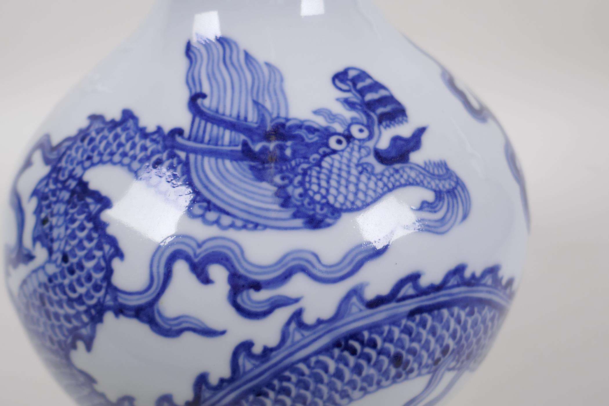 A blue and white porcelain vase decorated with a dragon in flight, Chinese Xuande 6 character mark - Image 2 of 9