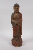 A Chinese carved and painted wood figure of Buddha, 30cm high