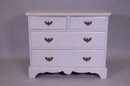Painted pine chest of two over two drawers and brass plate handles, raised on a shaped plinth