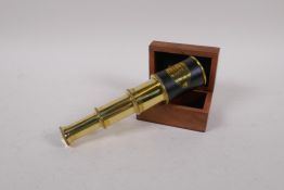 A Victorian style miniature brass marine telescope, boxed, 18cm long extended