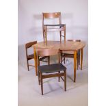 A mid century extending dining table and chairs by GFM (Goscicinska Fabryka Mebli), label to chair