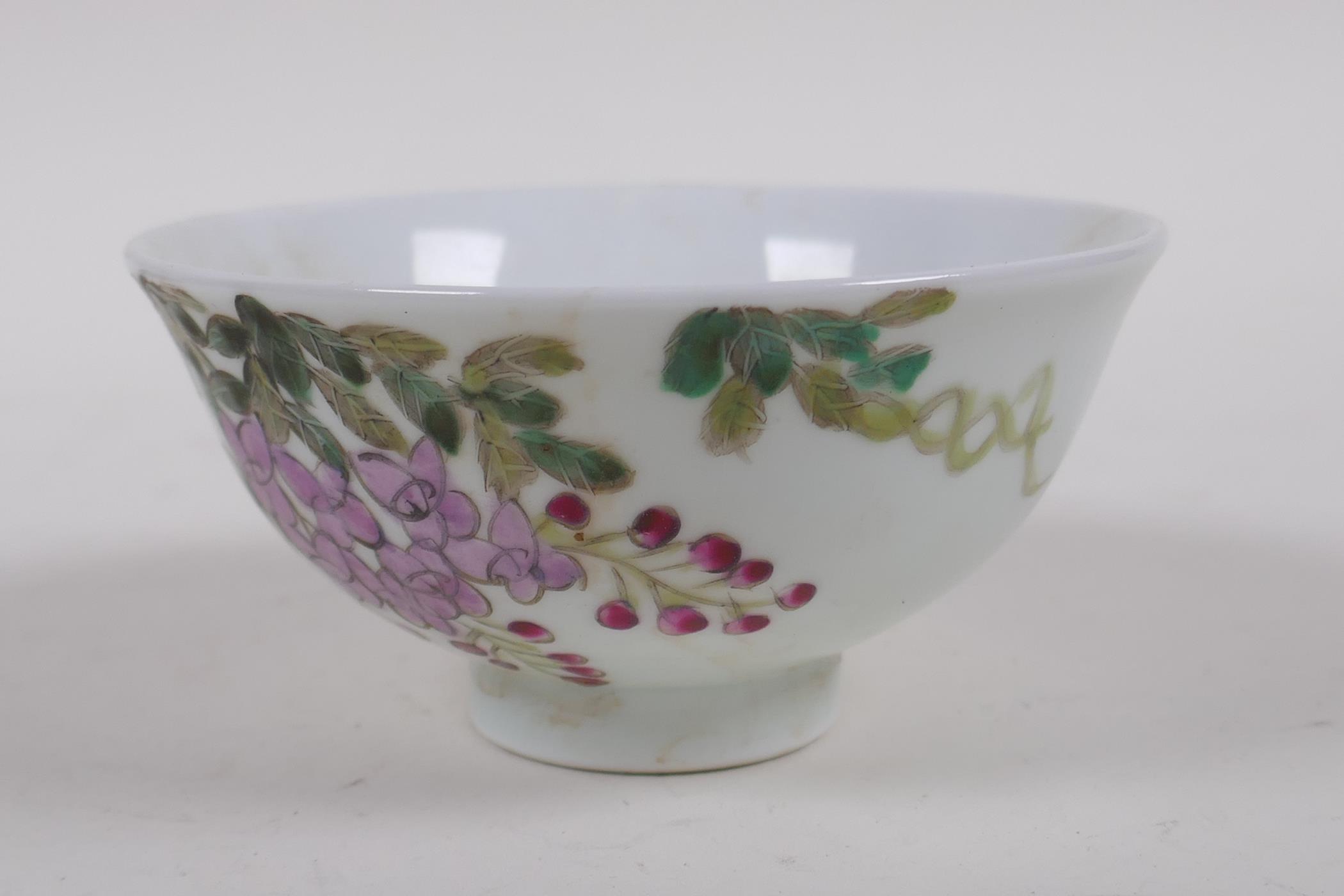 A polychrome porcelain tea bowl with bird and flower decoration, character inscription verso, - Image 2 of 5