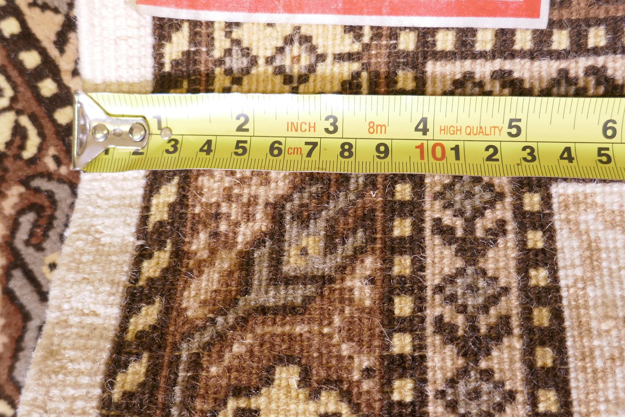 A Tunisian cream ground geometric rug with brown borders, 118cm x 190cm - Image 5 of 6