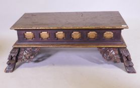 A Chinese wood stand/table with parcel gilt decoration, raised on carved and pierced splay supports,
