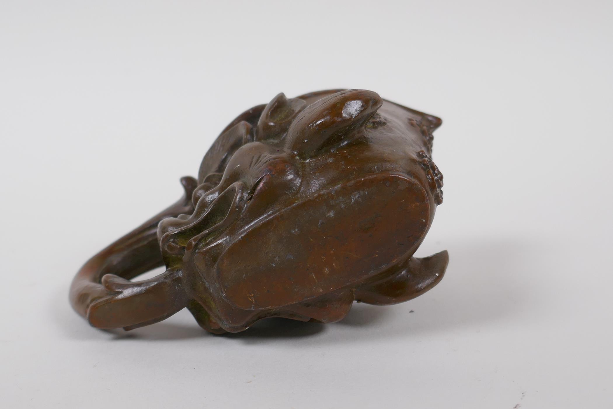 A Chinese bronze libation cup with dragon head decoration, 8 cm high - Image 4 of 4