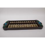 A Chinese hardwood abacus with celadon hardstone counters and inset coloured stone panels, 41cm x