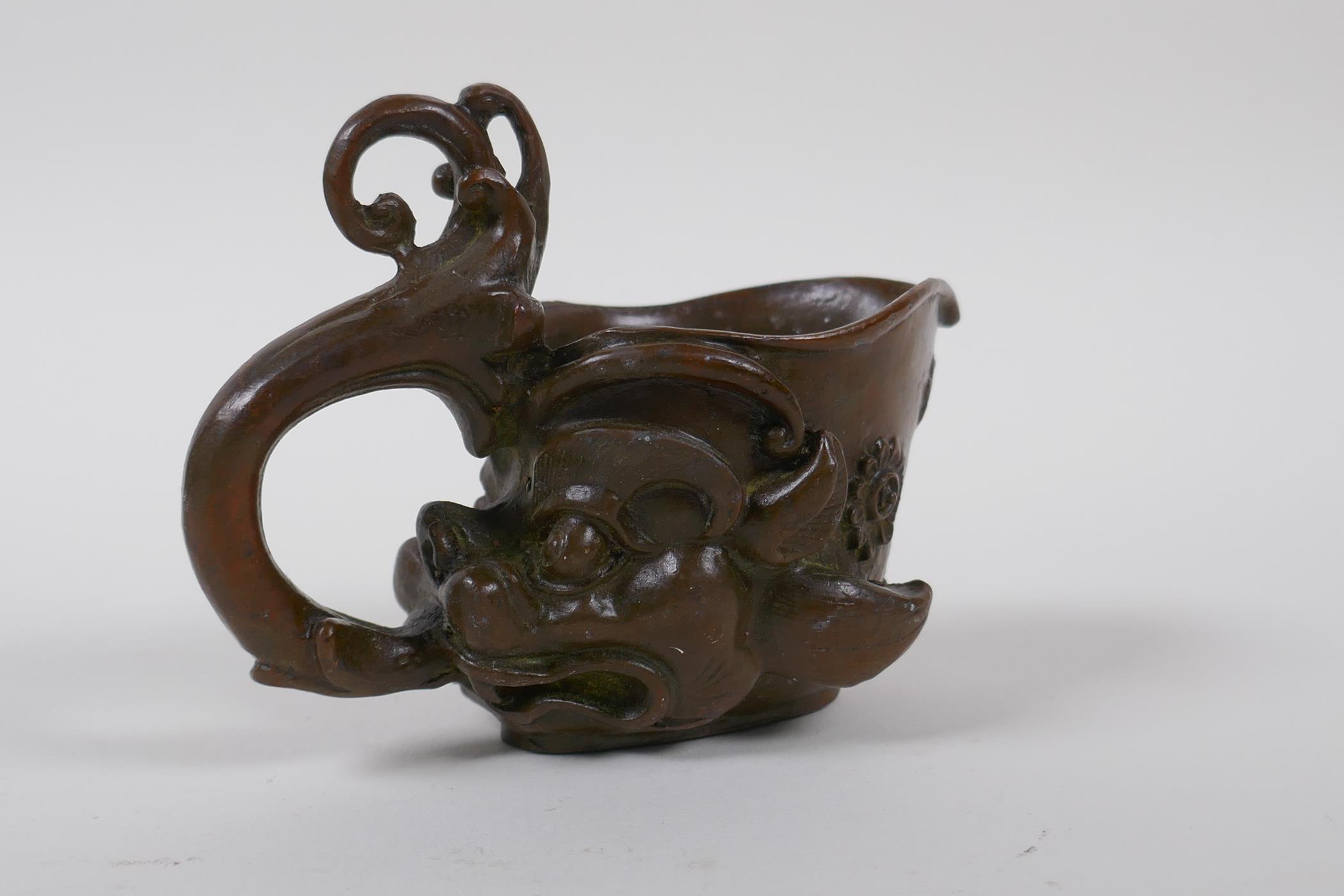 A Chinese bronze libation cup with dragon head decoration, 8 cm high - Image 3 of 4