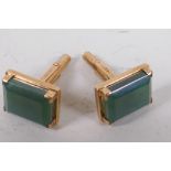 A pair of gold and green stone cufflinks, marked 14k, gross 12.1g