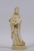 A Chinese white glazed ceramic figure of Quan Yin, 15cm high