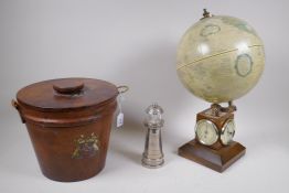 An antique leather bound ice bucket with Armorial decoration, a plated pepper mill in the form of