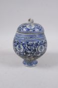 A Chinese blue and white porcelain pot and cover with all over auspicious character decoration, 15cm