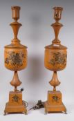 A pair of toleware table lamps with painted and parcel gilt decoration, 70cm high