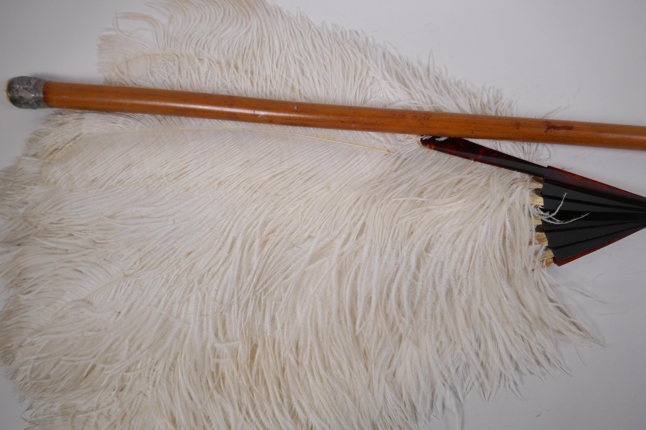 An ostrich feather fan with faux tortoiseshell blades, a malacca walking cane with oriental silver - Image 2 of 4