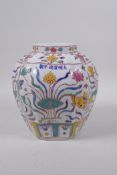 A polychrome lobed jar with enamelled decoration of carp in a lotus pond, Chinese Xuande 6 character