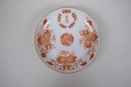 A C19th Chinese cabinet dish with iron red and gilt fruit and bat decoration, seal mark to base,
