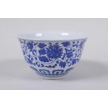 A blue and white porcelain tea bowl with scrolling lotus flower decoration, Chinese Qianlong seal