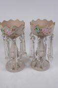 A pair of C19th milk glass lustres with crystal drops and painted floral decoration, some drops