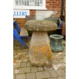 Antique saddle stone, 79cm high