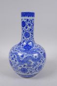 A Chinese blue and white porcelain bottle vase with dragon and lotus flower decoration, Qianlong