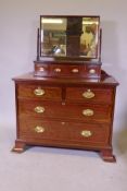 A Victorian inlaid mahogany chest of two over two drawers with brass plate handles, raised on shaped