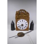 An early C19th French comtoise clock with repousse brass surround, enamel dial