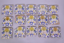 A collection of antique terracotta tiles with Islamic style lotus and palm designs, approx 20 x 20cm