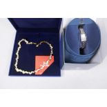 A Swarovski gilt metal and crystal necklace, 48cm long, and a lady's Citizen Eco-Drive wrist